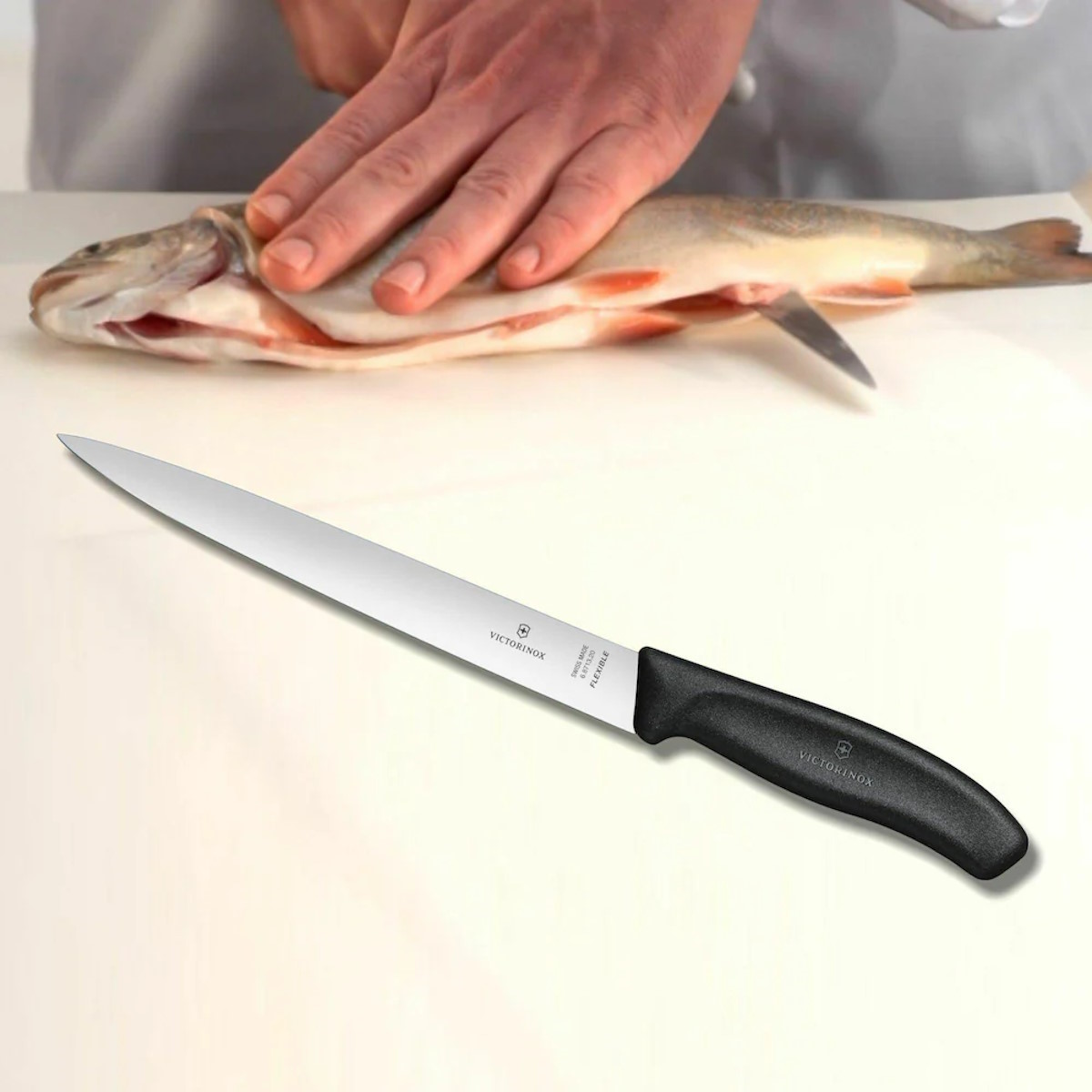 Victorinox filleting knife on a wooden cutting board