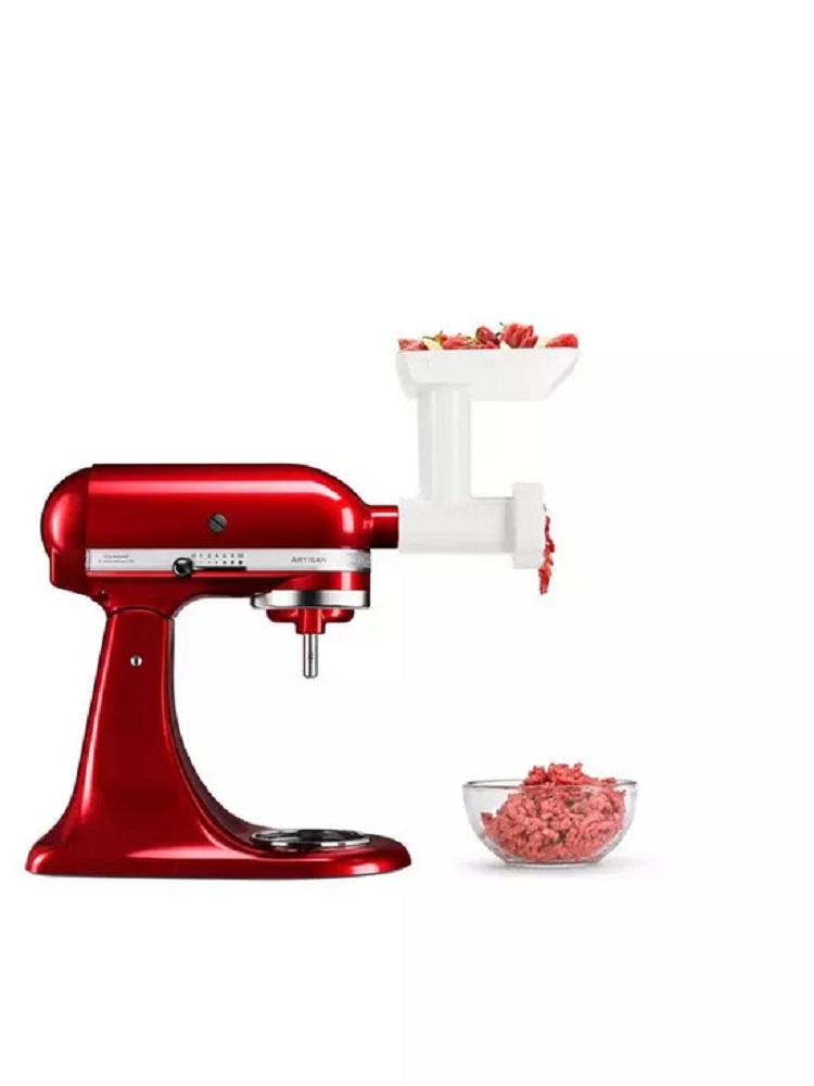 KitchenAid 5KSMFPPC food grinder attachment mounted on a stand mixer.