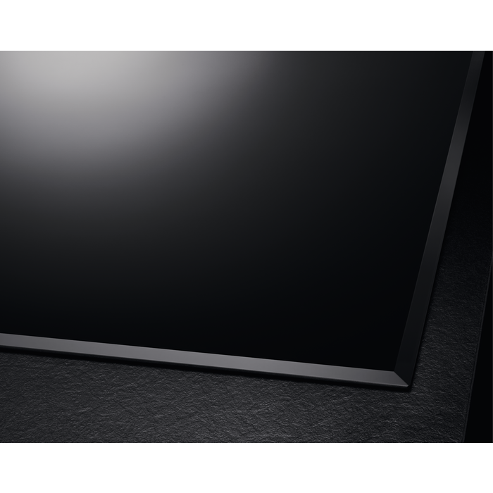 Side view of the AEG HK654070FB highlighting the bevelled edge glass design