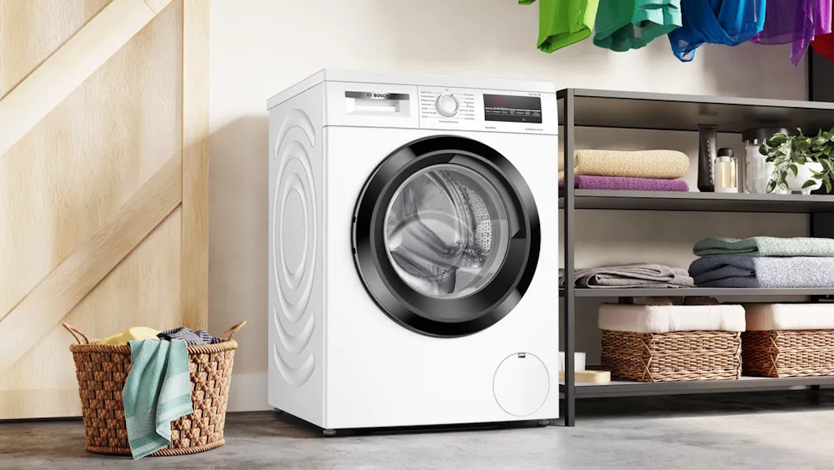 Bosch WUU28T48 washing machine installed under a kitchen countertop.