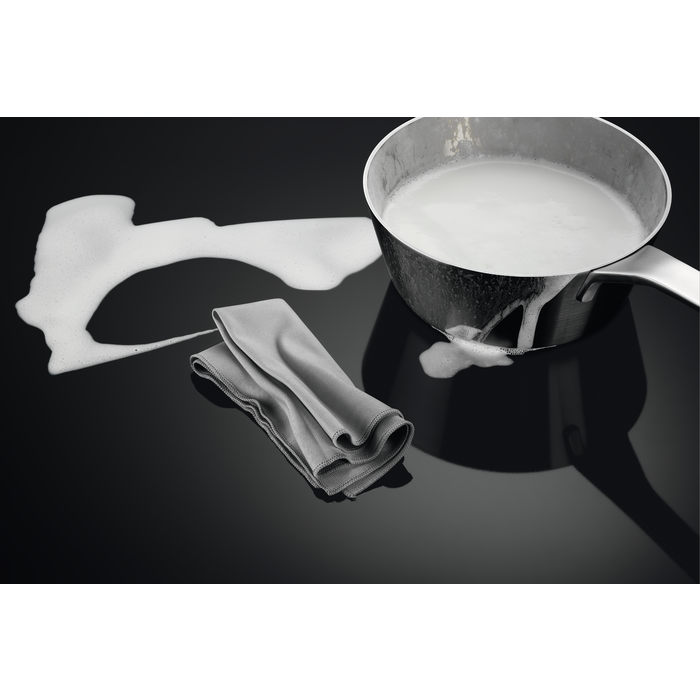 A detailed close-up of the cooking zones and the hob surface.