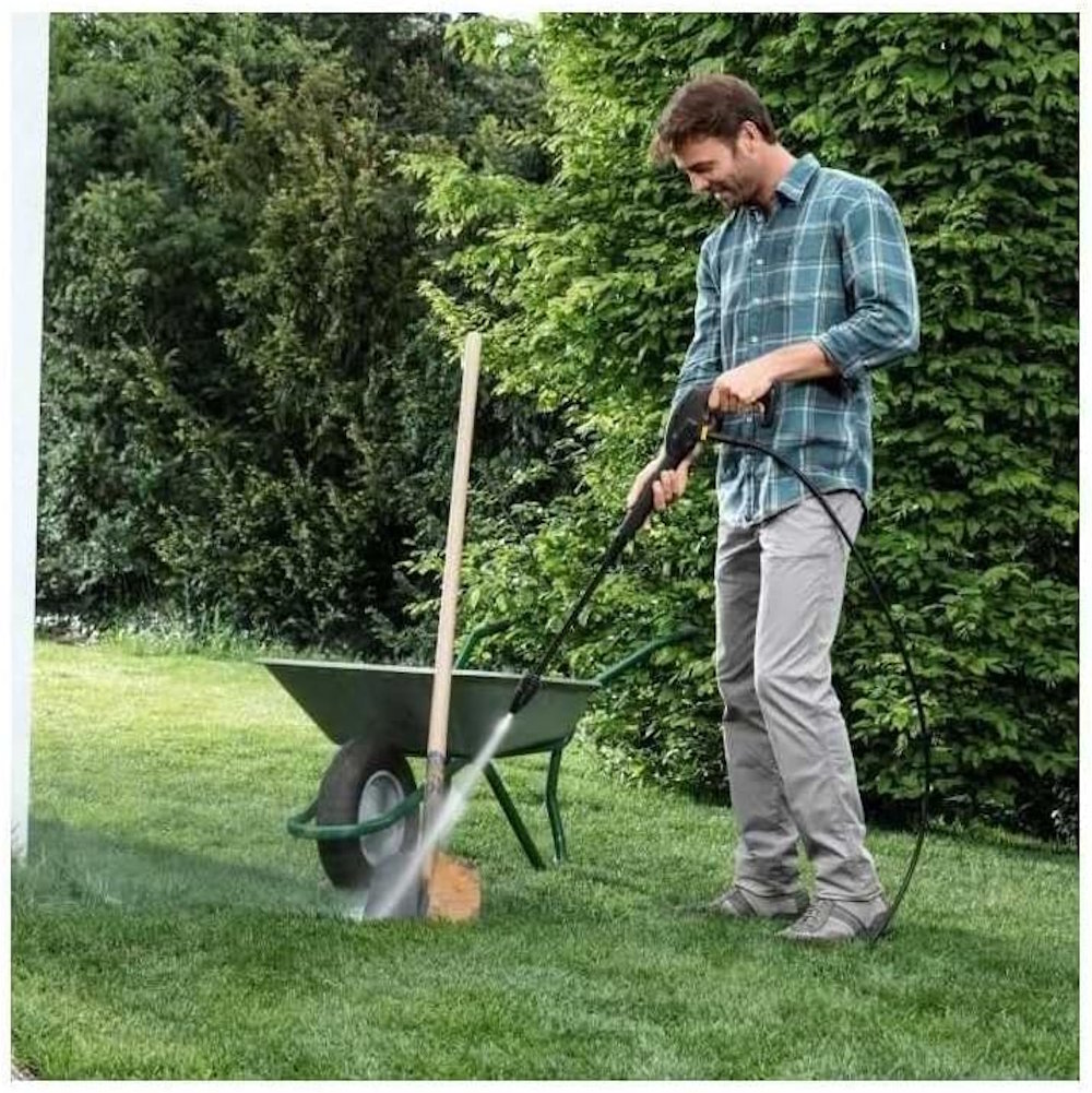 Kärcher K2 Universal Edition cleans garden tools with a high-pressure jet.