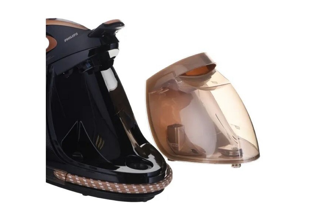 Detail shot of the Philips base station with the detachable water tank placed next to it for easy refilling