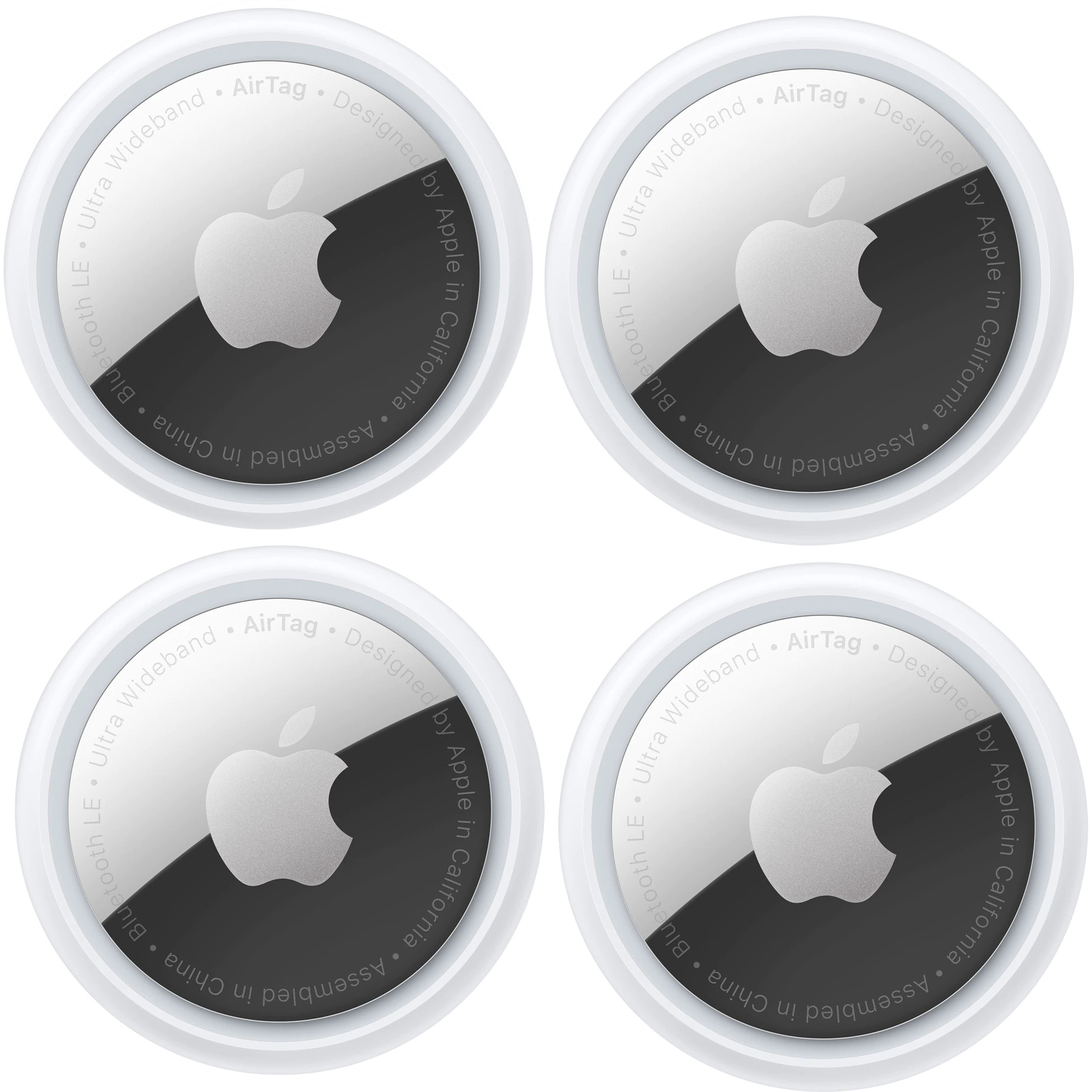 Four Apple AirTags side by side on white background.