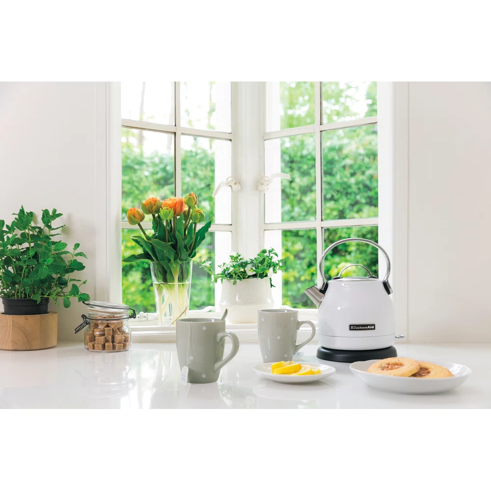 KitchenAid 5KEK1222EWH kettle in White on a modern countertop in a stylish setting.