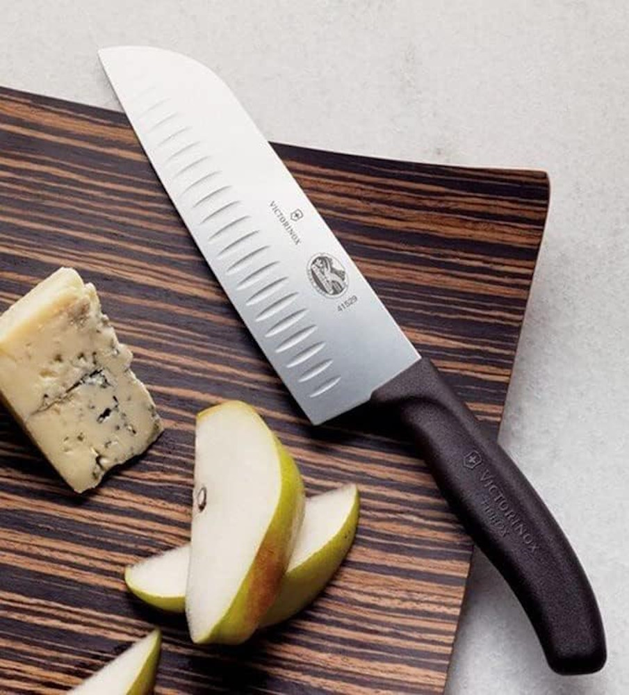 Victorinox Santoku knife precisely cuts a pear.