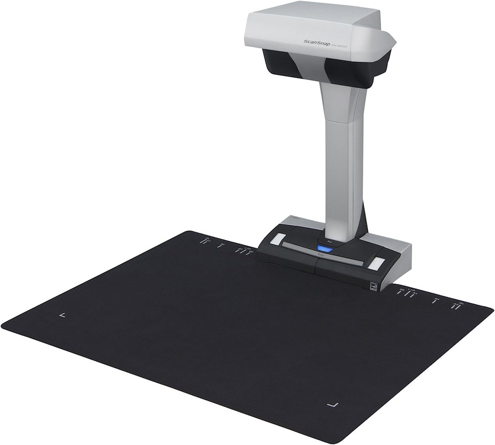 RICOH ScanSnap SV600 overhead scanner in front of a black scanning mat for A3 documents