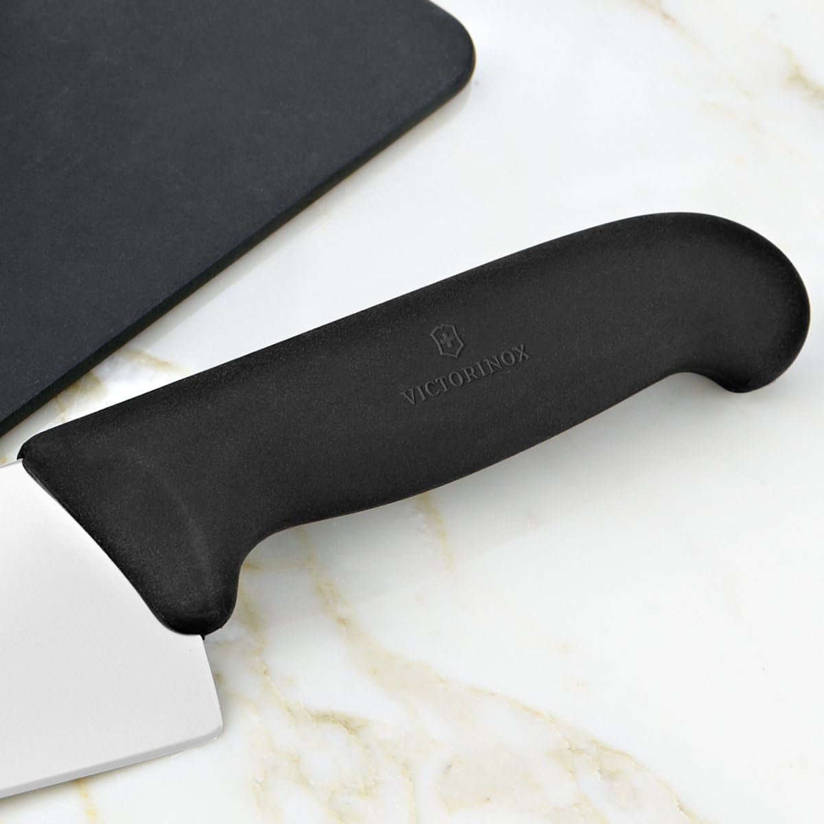Close-up of the black Fibrox handle of the chef's knife
