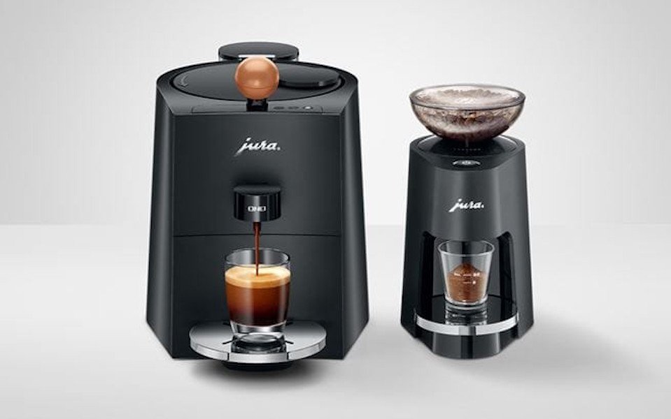 JURA ONO coffee machine next to a JURA P.A.G. Premium coffee grinder
