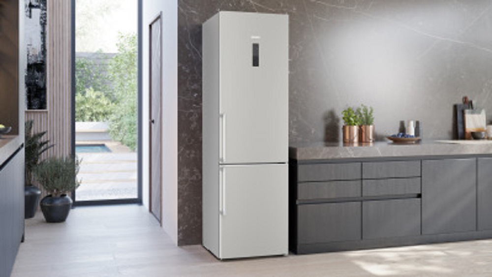 Siemens KG39NAICT iQ500 refrigerator in modern kitchen, lifestyle image with open door