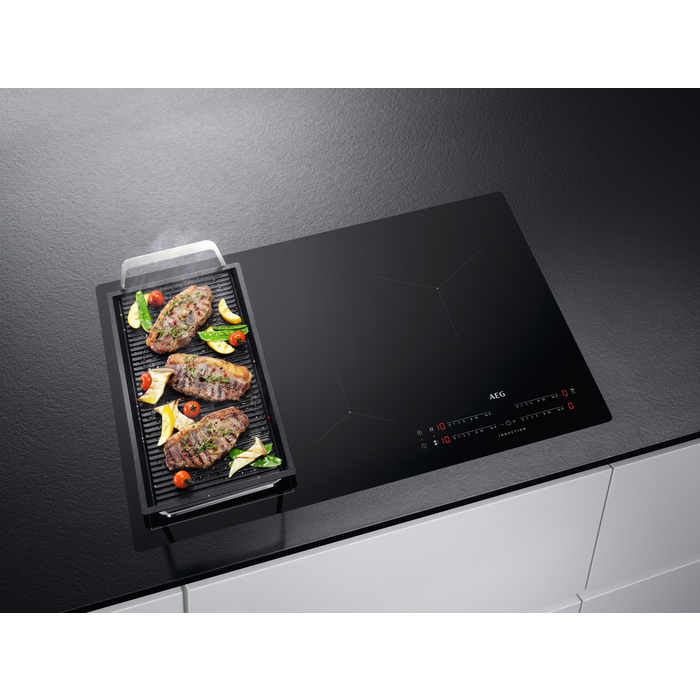 A detailed close-up of the cooking zones and the hob surface.