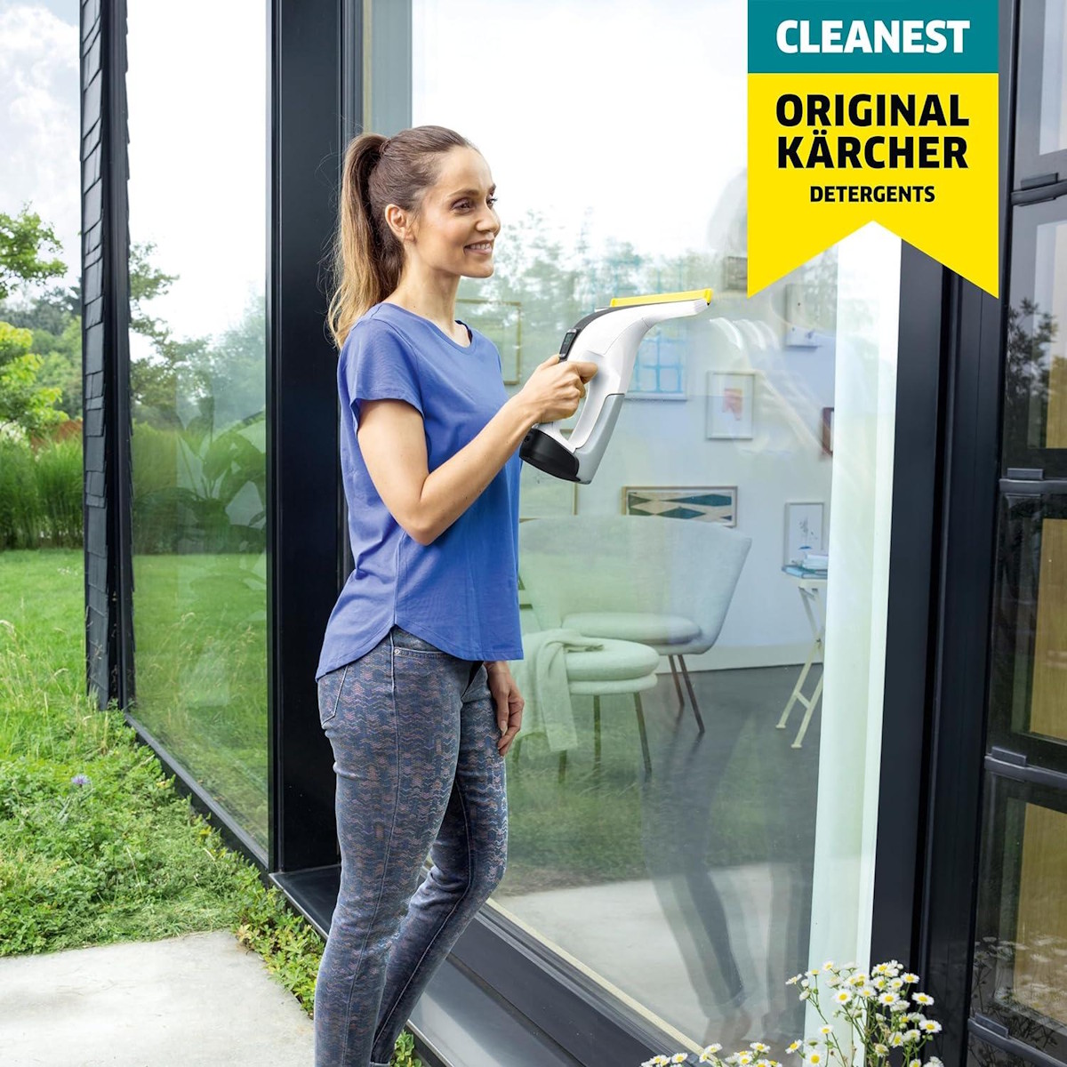 Woman cleans a window using Kärcher Window Cleaner RM 503 concentrate