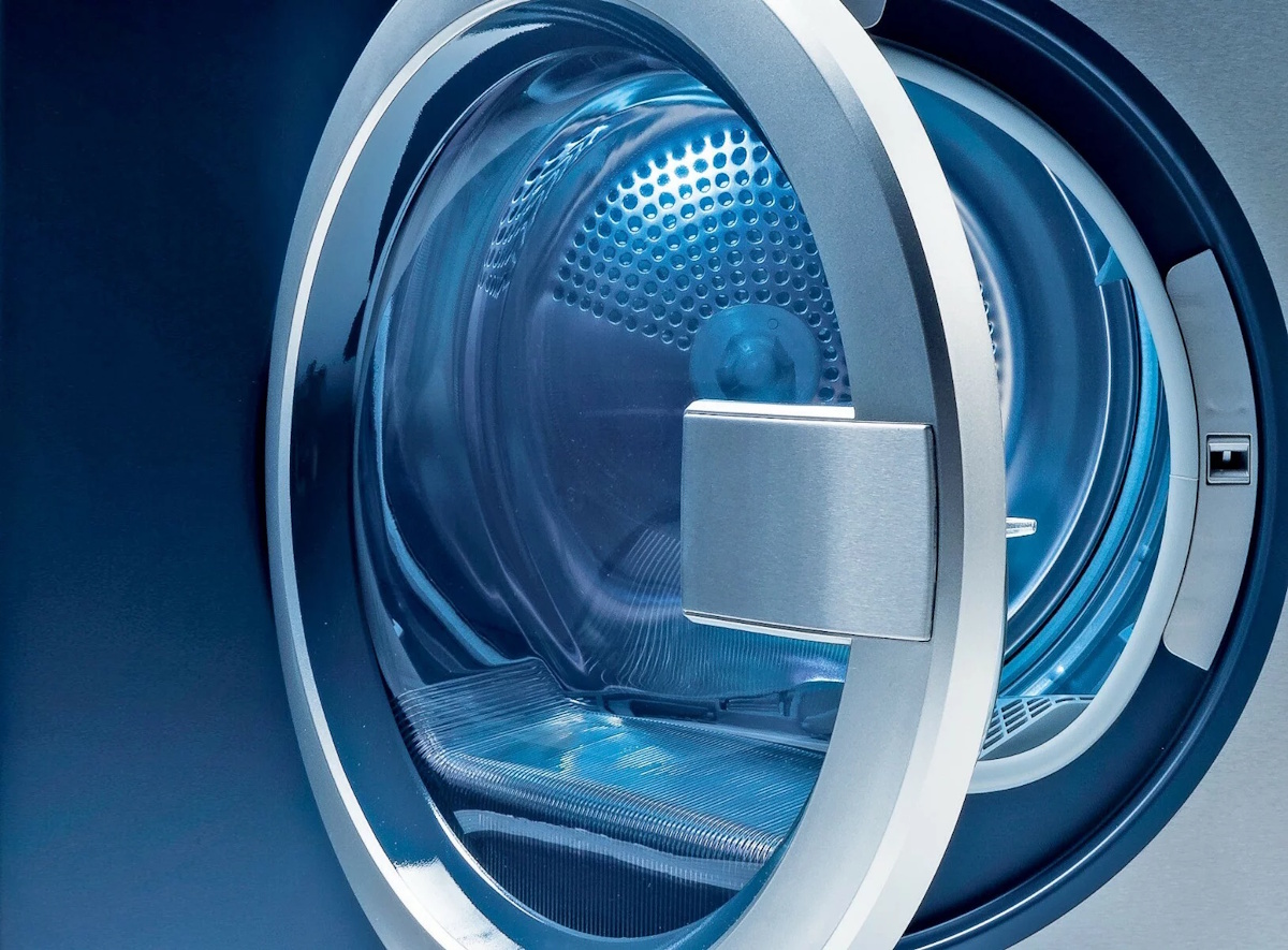 Close-up of the silver door frame and the internal honeycomb drum structure of the Electrolux dryer.