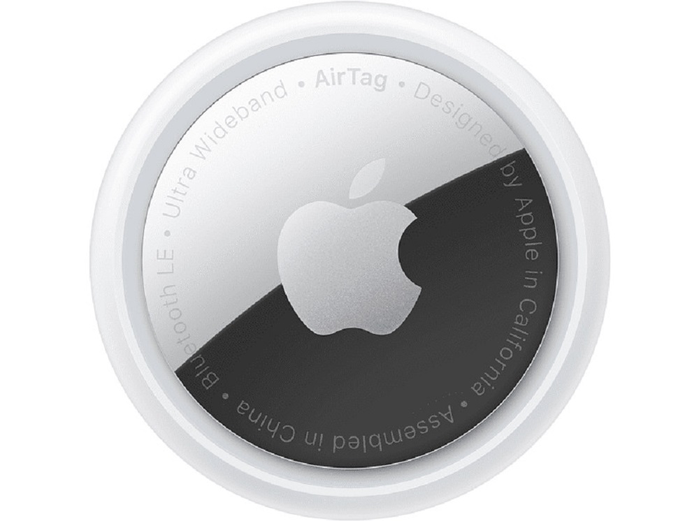 Close-up of an Apple AirTag, white tracker on white background.